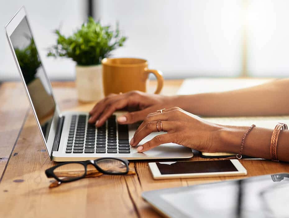 Close up shot of woman using a laptop