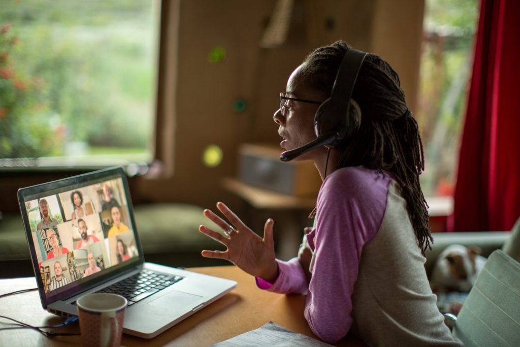 woman videoconferencing with headset