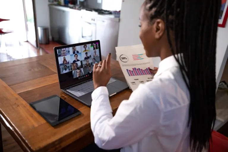 Woman presenting a project to colleagues through video call