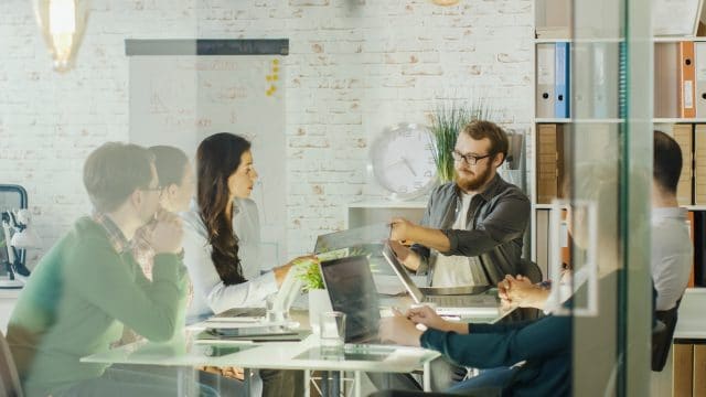 People of Innovative Agency Discuss Technology of Solar Panel on their Daily Strategic Meeting. They Sit in Modern Conference Room.