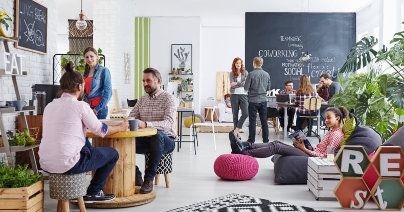 People working in modern startup agency relaxing during a break