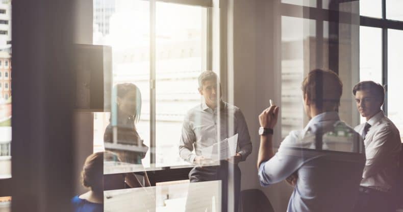 business people having discussion in board room