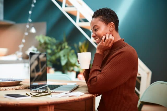 woman working from home video conference with coworkers