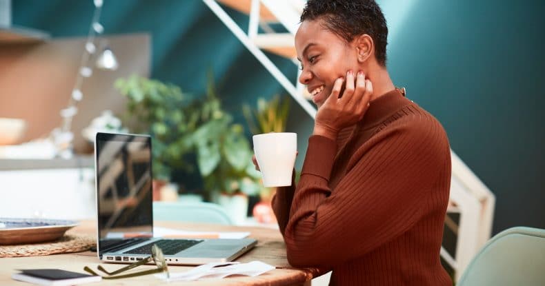 woman working from home video conference with coworkers