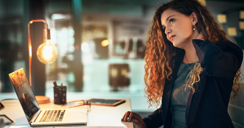 Shot of a businesswoman suffering burnout while working from home