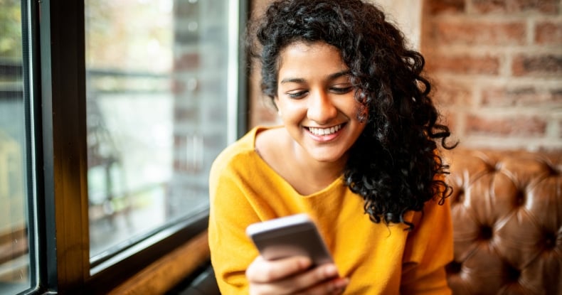 Woman using social media on mobile phone