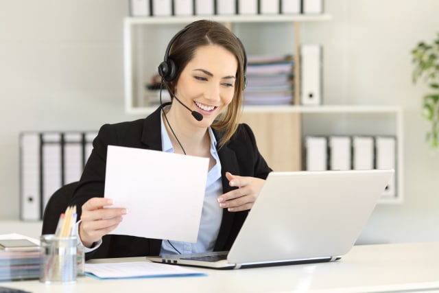 Contact centre agent delivering customer service from her home office