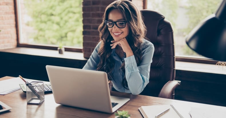 Female CIO working on laptop at her desk