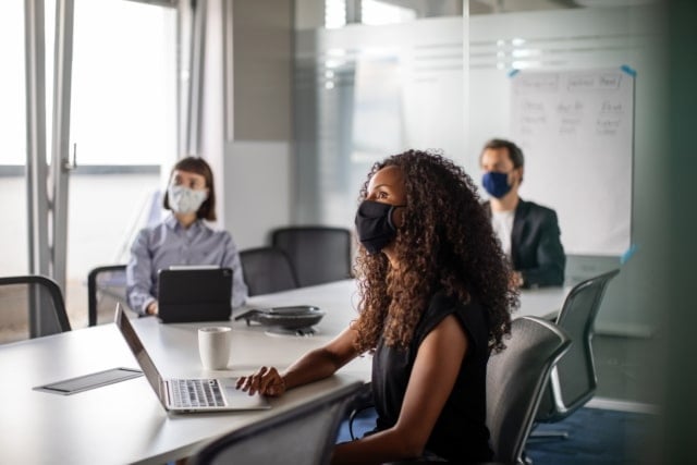 Business people having meeting during pandemic