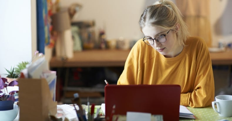 Female student at home studying.-422