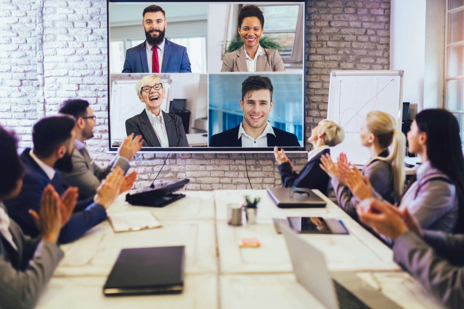 Business people looking at a screen during a video conference in the conference room-763