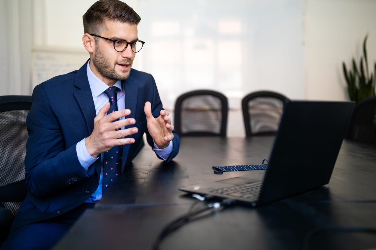 Businessman explaining new plan to customers over video call