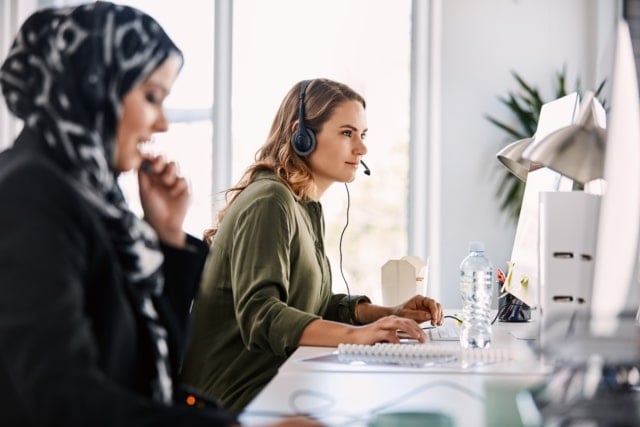 woman working at her desk in a contact centre