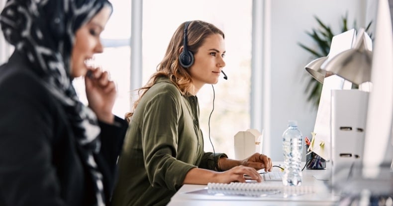 woman working at her desk in a contact centre