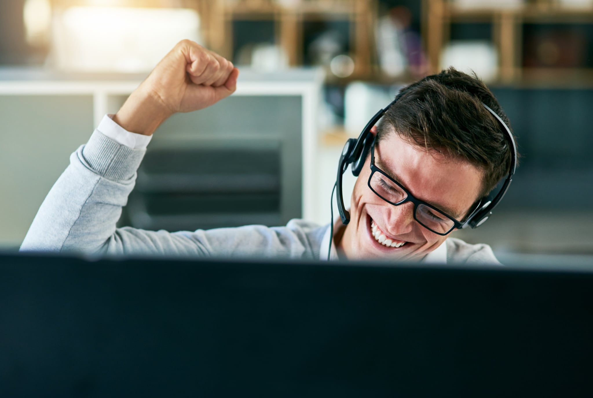 cheering while working in an office