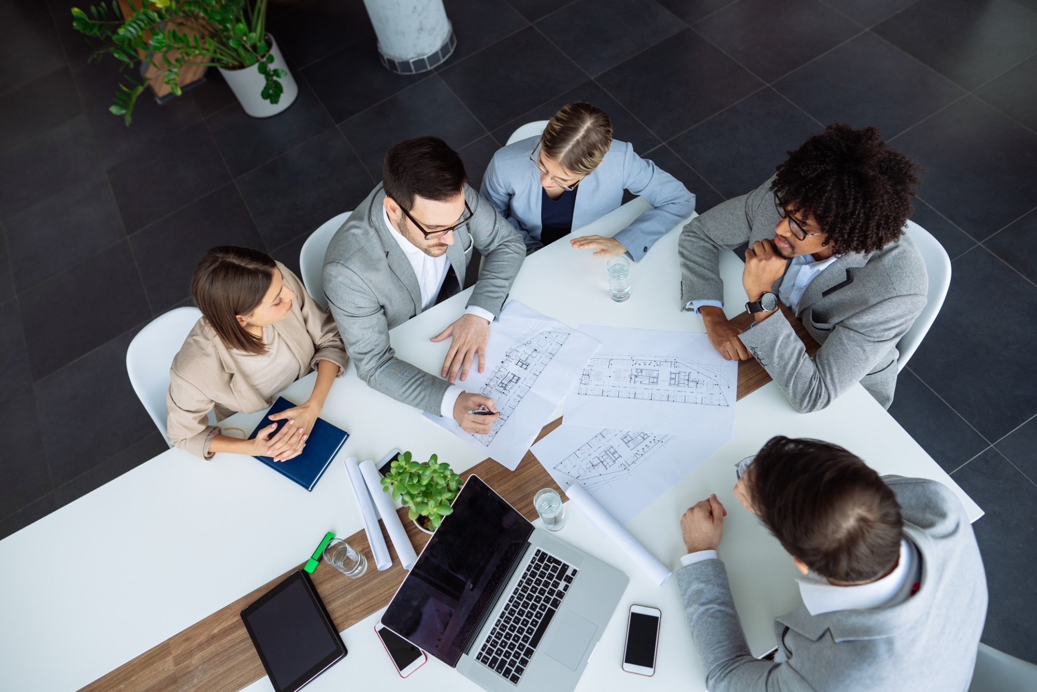 working on plans in board room