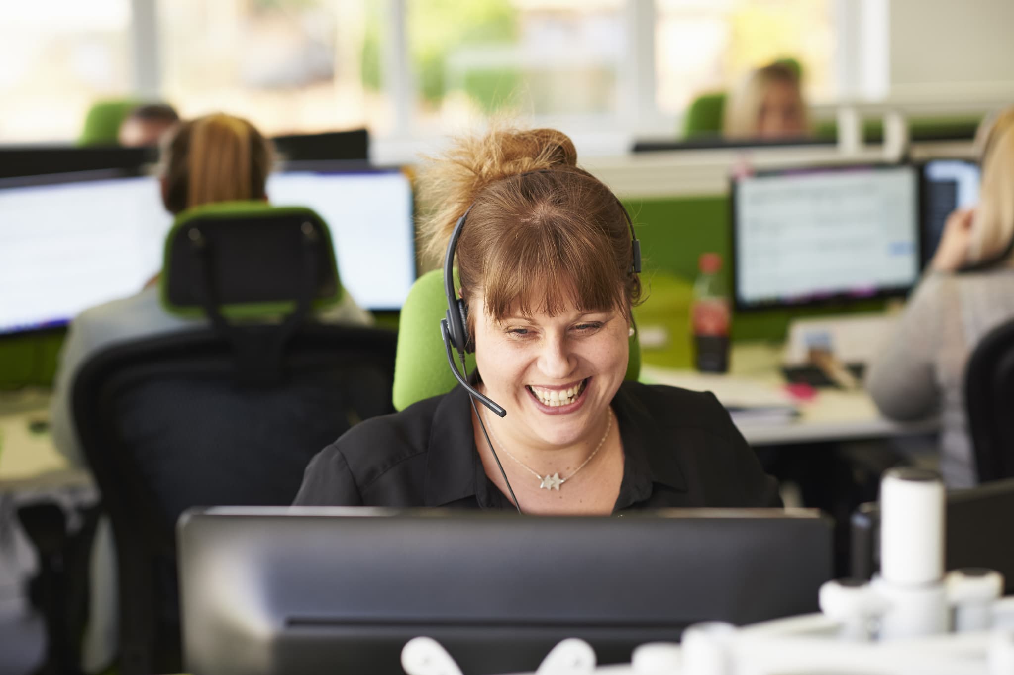 Woman taking call in call centre-398