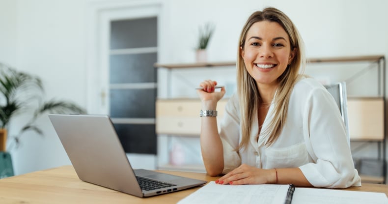 Portrait of a cheerful accountant at home office.-537