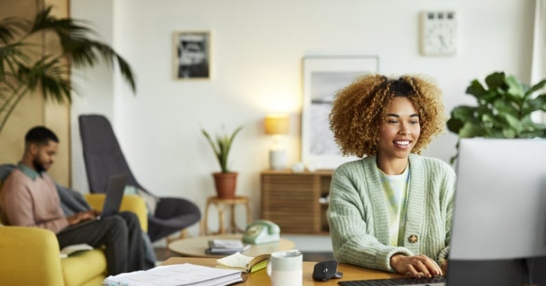 Businesswoman Using Computer In Home Office-970