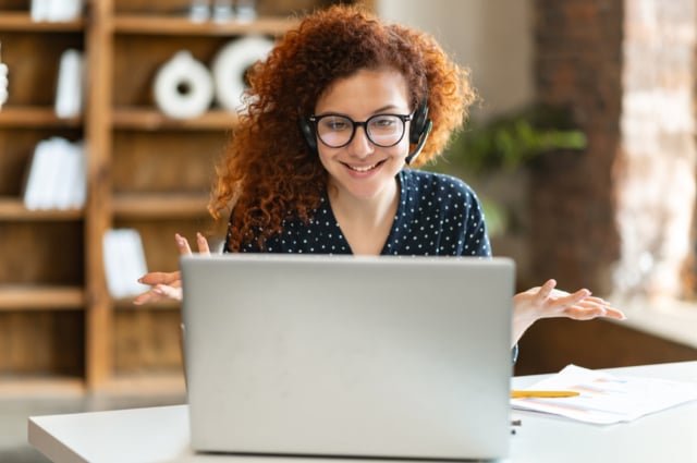 A busy woman working from hybrid work setup