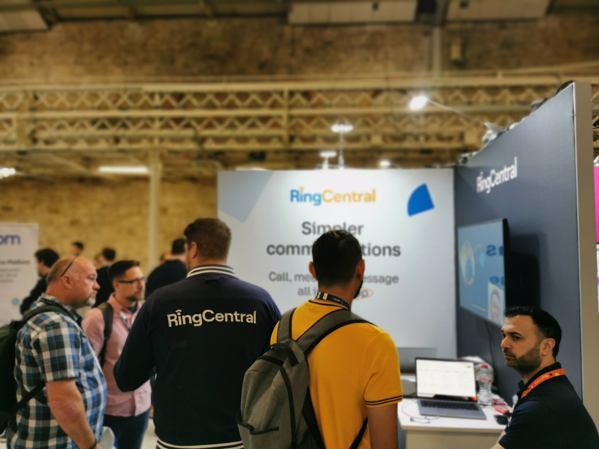 People milling around an exhibitor stand