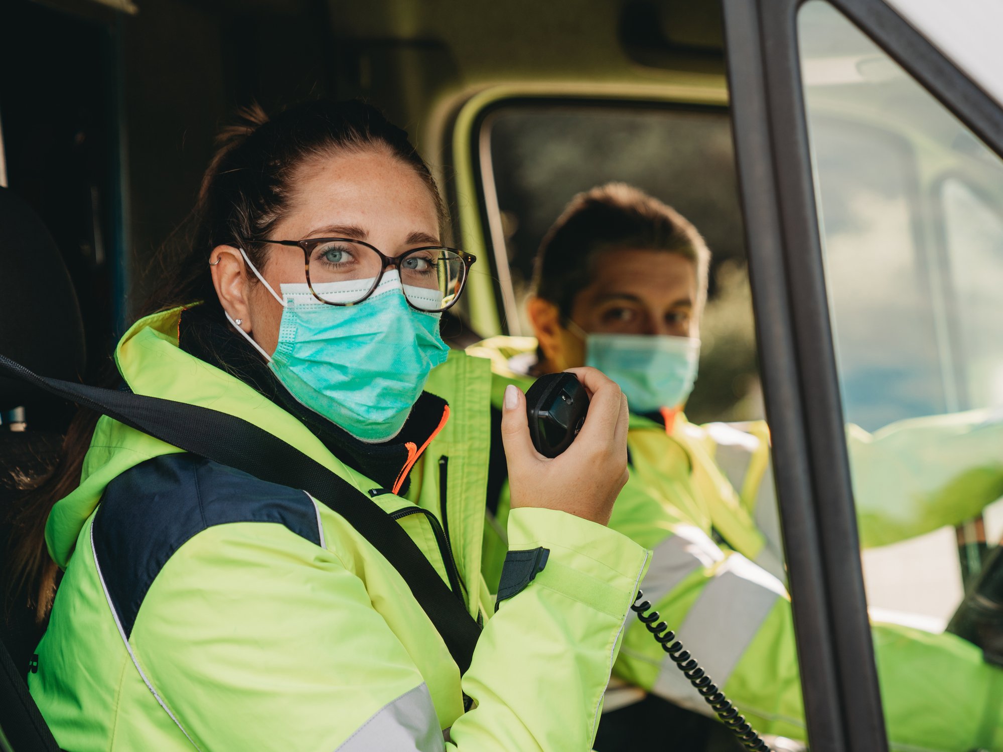 Young woman answering a call in an ambulance-850