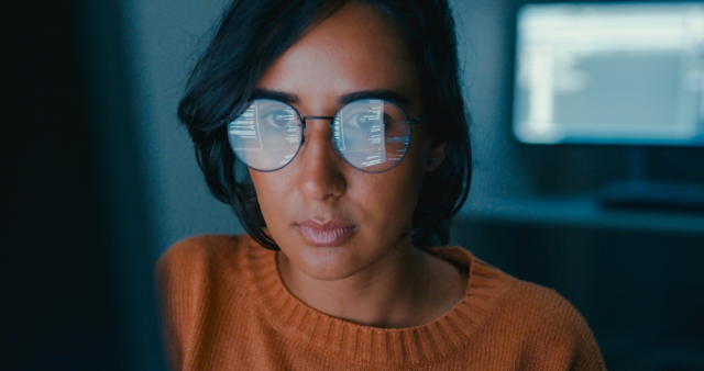 Woman working diligently in an office setting