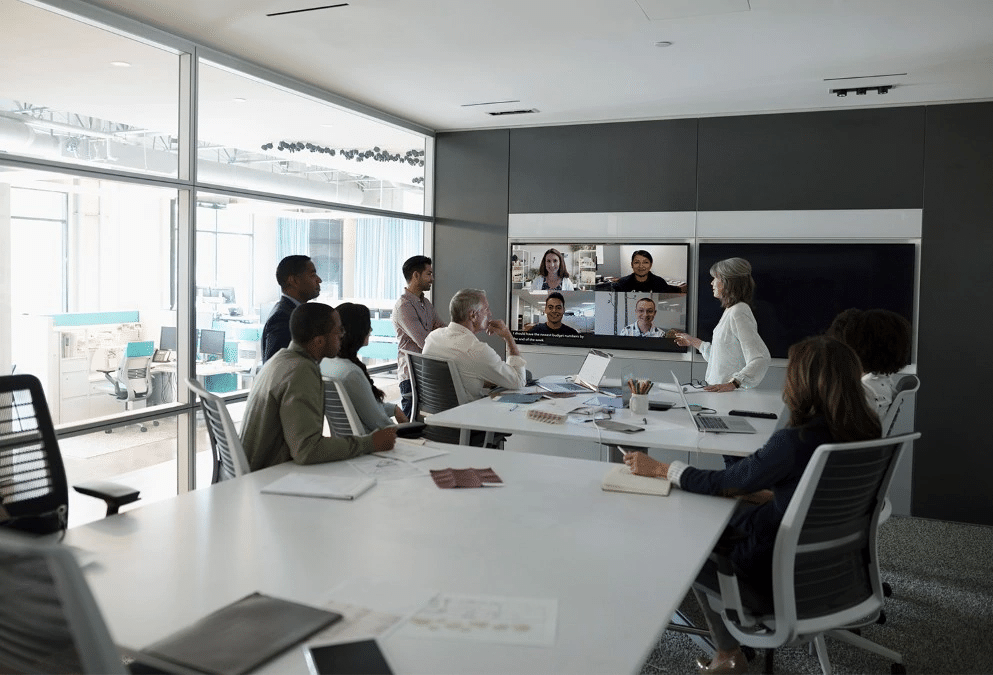 A hybrid team holding a video meeting