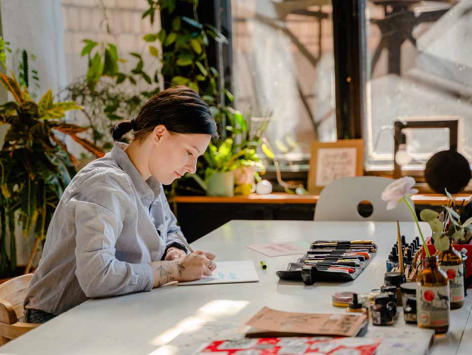 Startup business owner working on a project from her desk