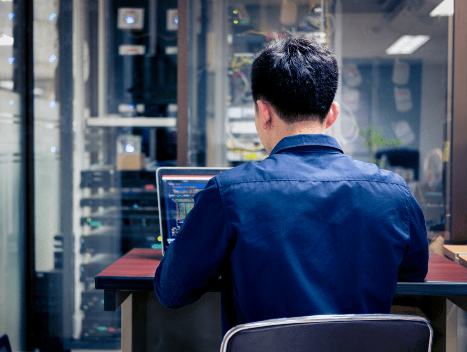 An employee reading and learning about IT and technology terms