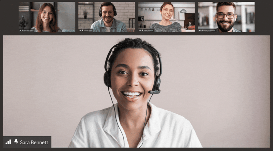 Closeup of woman at laptop during video meeting