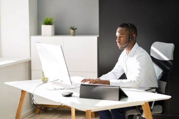 Working at a desk with a headset