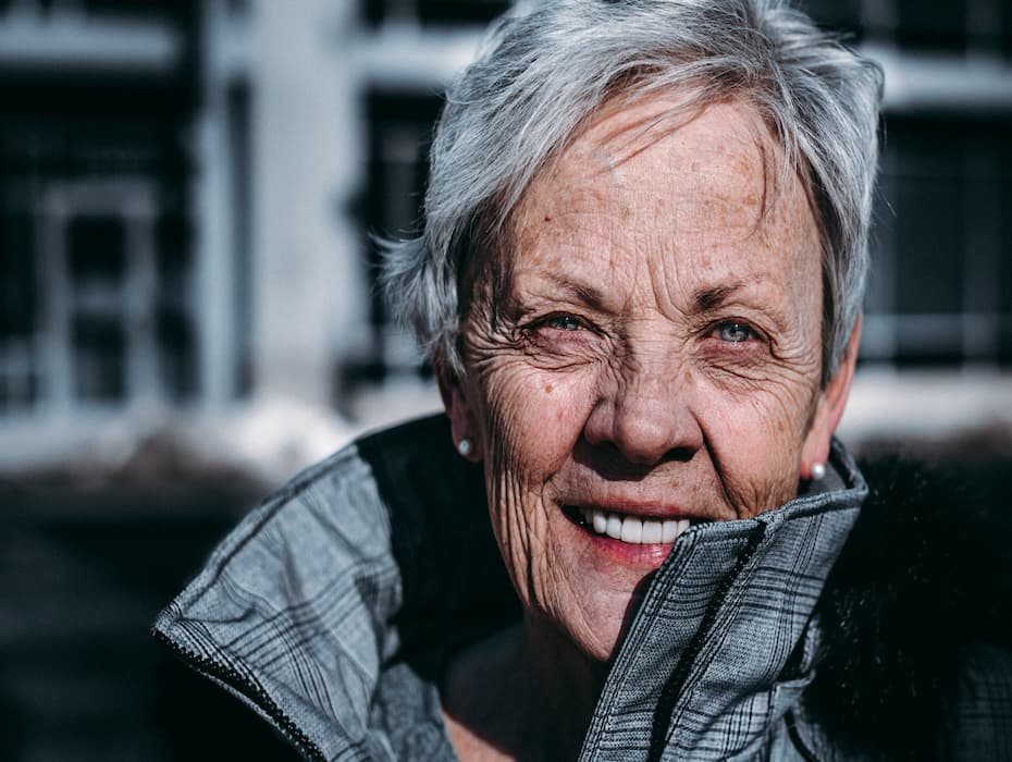 older woman smiling at camera