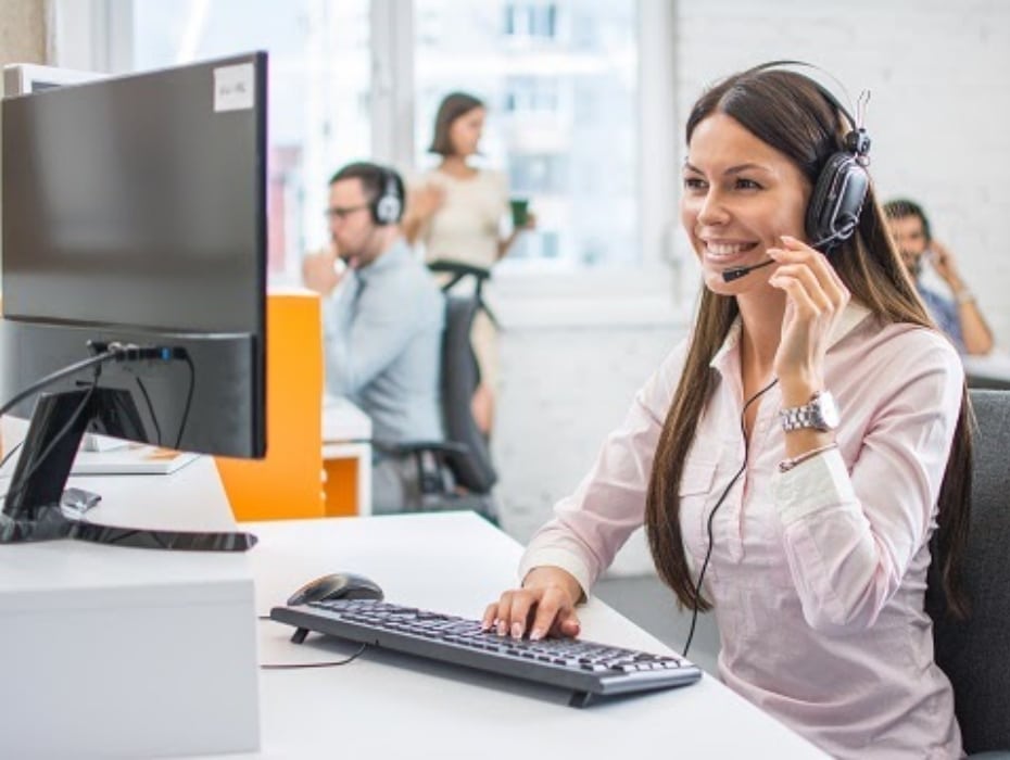 Friendly female helpline operator in call center