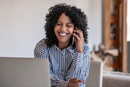 Smiling woman on the phone