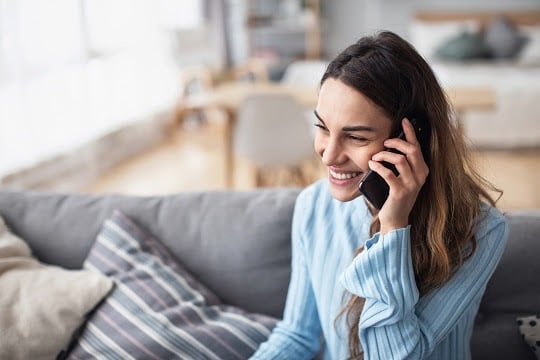 Customer talking to a contact center agent, having her questions answered