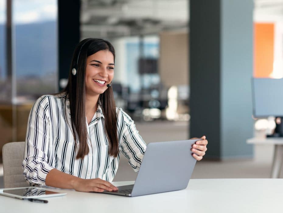 Happy smiling woman working in call center