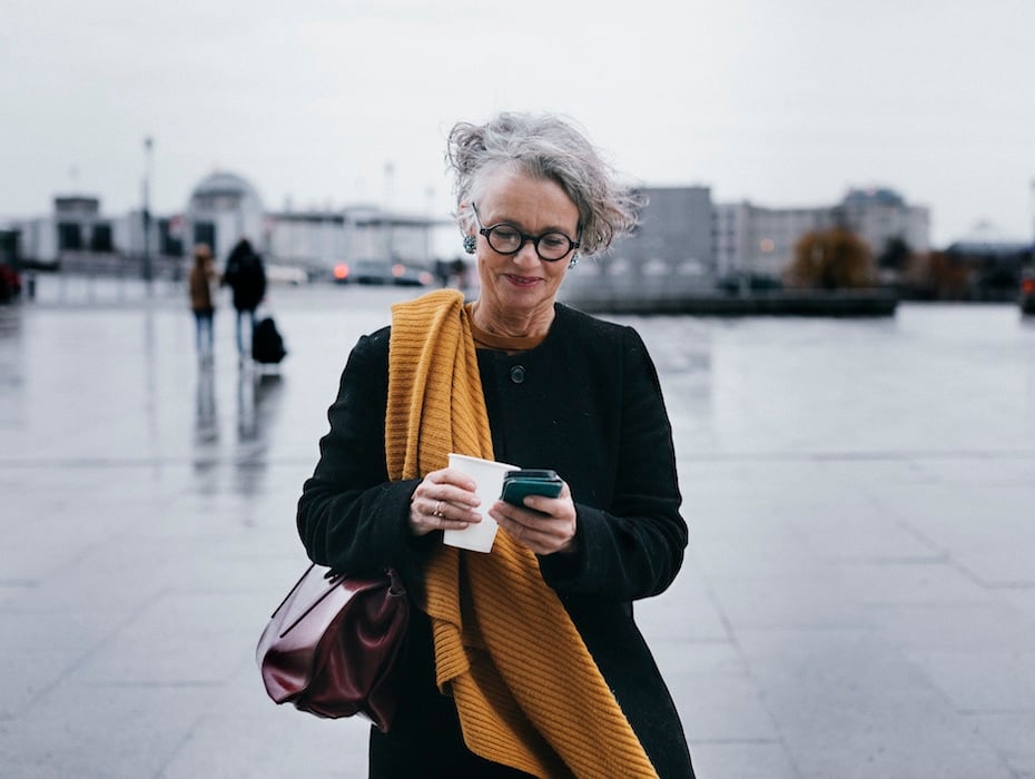 Business woman on mobile phone powering customer experience