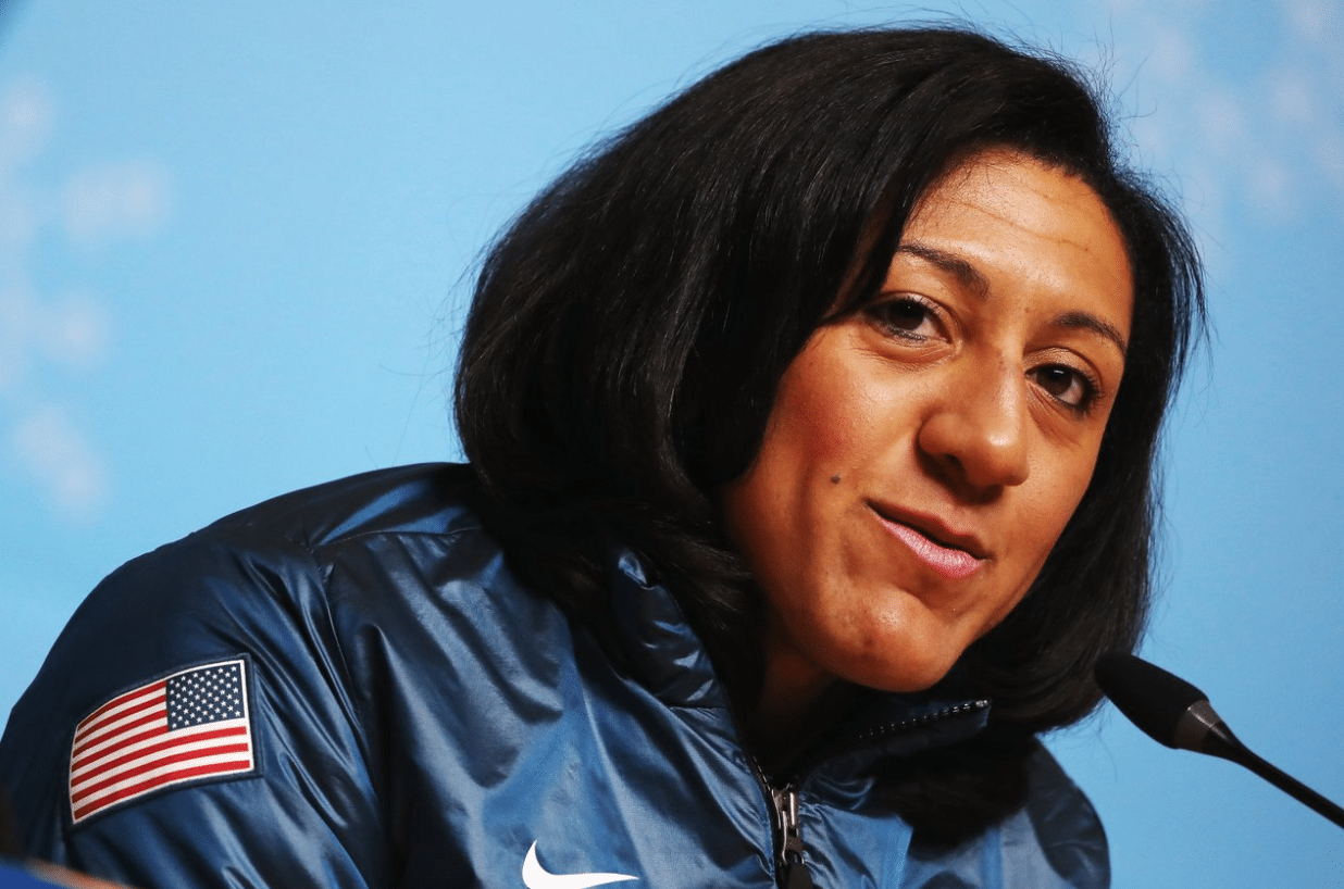 Bobsledder Elana Meyers Taylor speeks into a microphone.