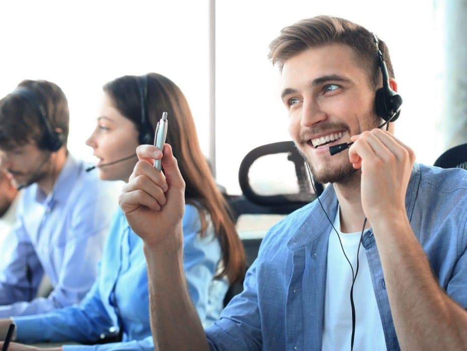 smiling contact center agent speaking with a customer