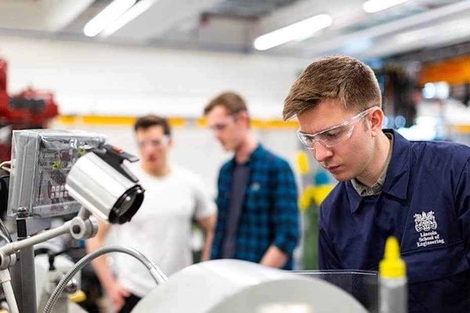 Students wearing protective eye gear in a lab