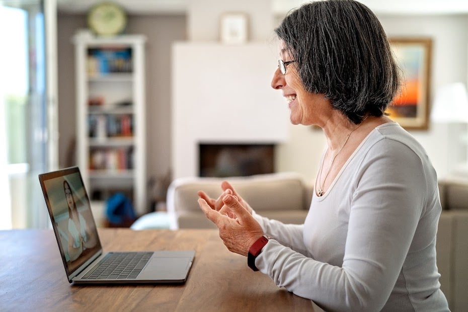 A teacher with a growth mindset learns new skills remotely as she sits in front of her laptop at home