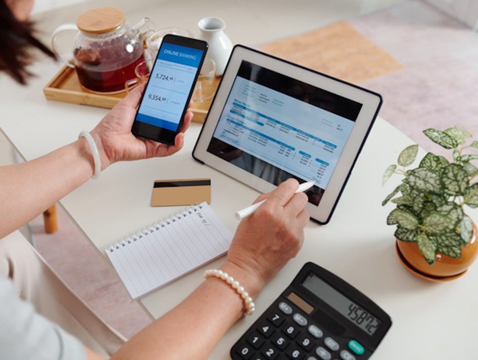 A financial services professional uses digital communication tools at a desk