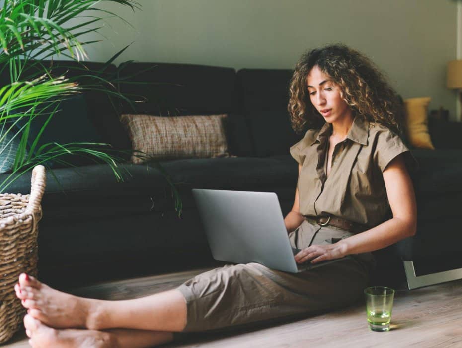 sitting on the floor with a laptop