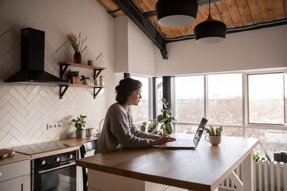 A customer accesses her bank services via her laptop computer.