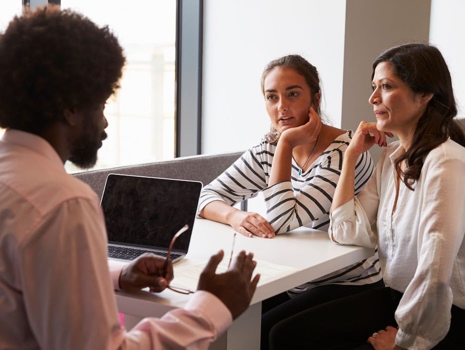 A teacher communicates with a parent and student