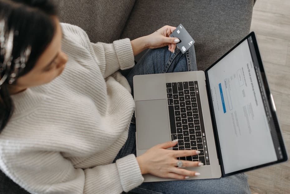 Credit union customer uses laptop computer