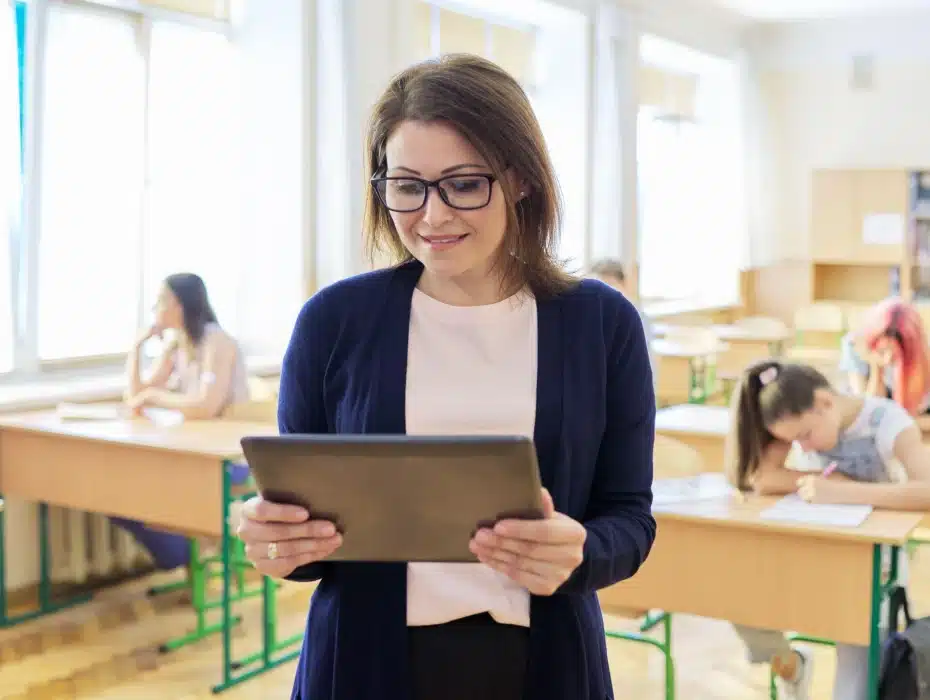 teacher using technology in a classroom