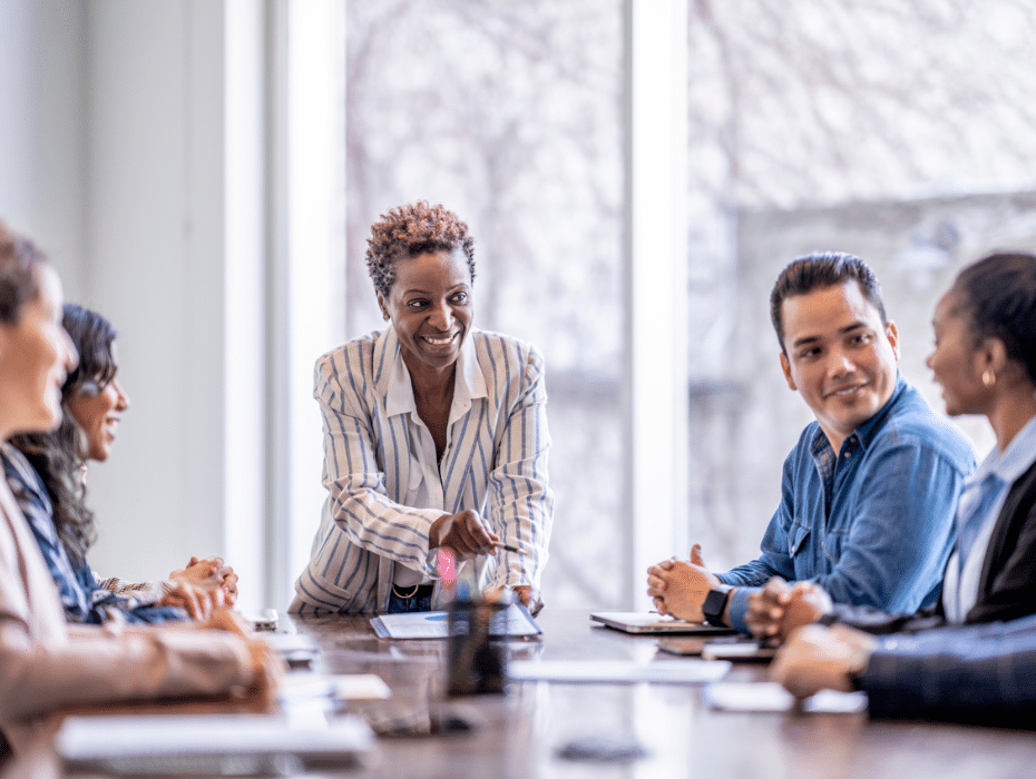 Multiethnic group of employees meeting together in a meeting room