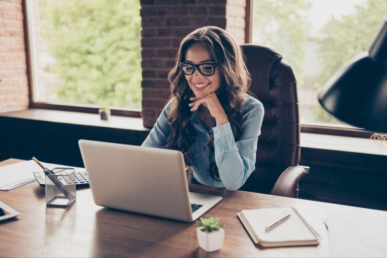 credit union manager at her desk utilizing RingEx UCaaS platform